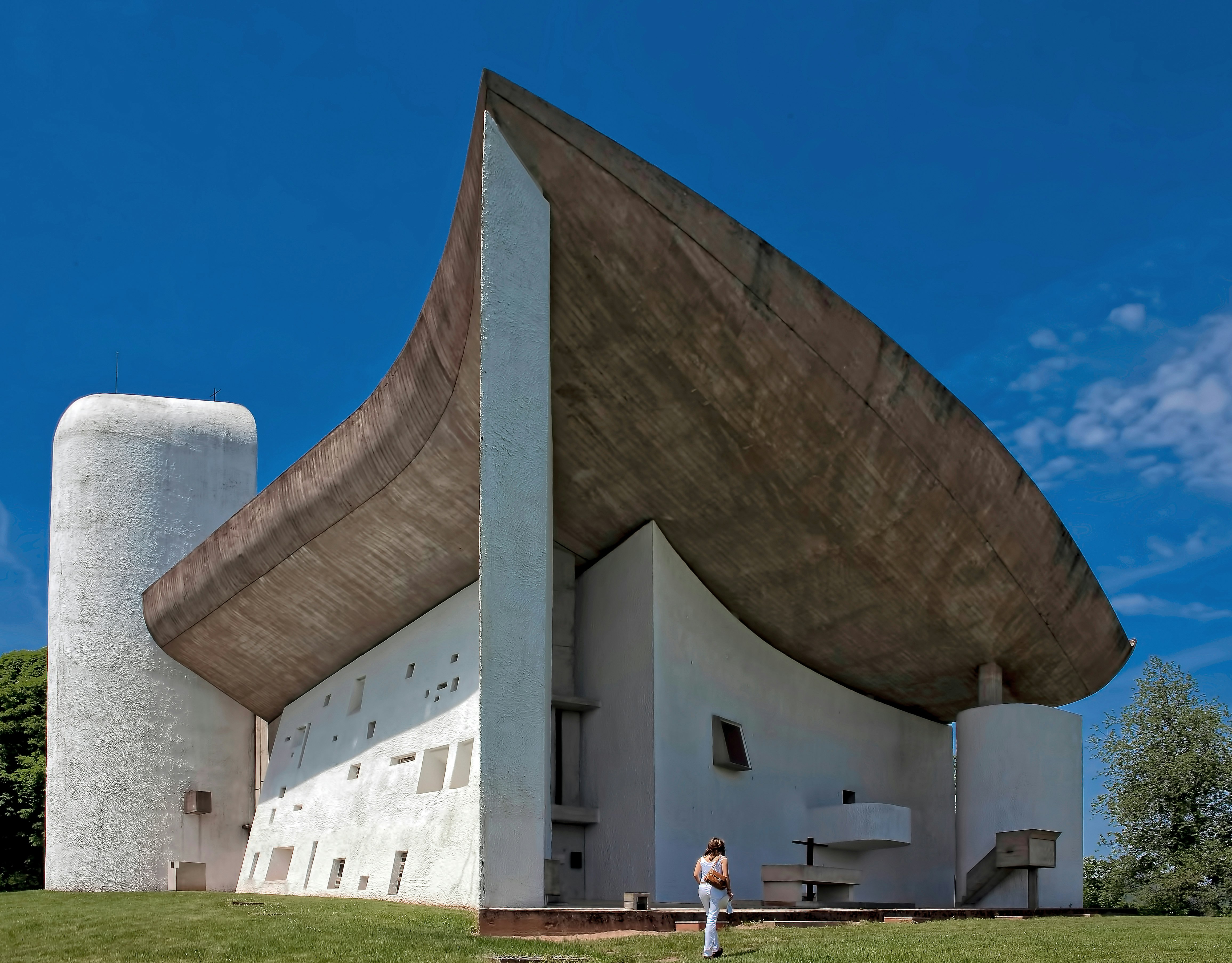 person standing in front of white building